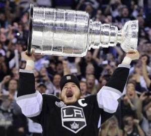 Kings captain Dustin Brown hoists the cup, a trophy of a dying sport.  By Eric Chan from Hollywood, United States (DSC00815 Uploaded by JoeJohnson2) [CC-BY-2.0 (http://creativecommons.org/licenses/by/2.0)], via Wikimedia Commons