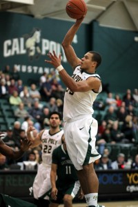 Chris Eversley executes a jump-hook in the lane, one of many moves in his entire arsenal.  Photo by Owen Main