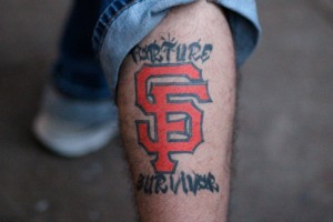 This Giants fan called himself a "torture survivor." He got his picture taken with the trophy last Thursday. By Owen Main