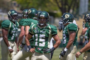 Vince Moraga (15) is the most experienced of Cal Poly's four quarterbacks competing for the starting role in 2013. By Owen Main