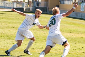 Chase Minter celebrates with Matt LaGrassa (20) after LaGrassa's game-tying goal. By Owen Main