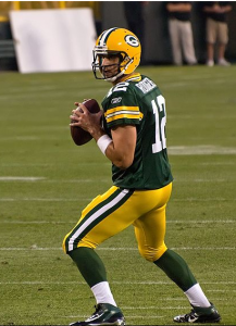 Even with injuries to his offense, Aaron Rodgers like Tom Brady has performed well this season. By Mike Morbeck (originally posted to Flickr as Aaron Rodgers) [CC-BY-SA-2.0 (http://creativecommons.org/licenses/by-sa/2.0)], via Wikimedia Commons