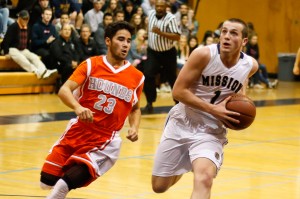 Mission Prep junior Quinton Adlesh takes the ball to the basket against Atascadero on Friday night. By Owen Main