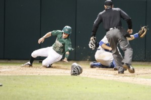 Jimmy Allen slides home safely for Cal Poly's seventh run in the fourth inning. Cal Poly wouldn't score again until the 9th. By Owen Main