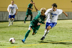 Chase Minter's shirt is almost ripped-off as a Drake defender executes to perfection. By Owen Main