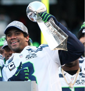 Will Russell Wilson lead the Seahawks back to the Super Bowl in 2015? Or will another team dethrone them? By andrewtat94 (cropped from) [CC-BY-SA-2.0 (http://creativecommons.org/licenses/by-sa/2.0)], via Wikimedia Commons