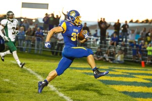 South Dakota State's Zach Zenner rushes for a 15-yard touchdown on Saturday night. Zenner rushed for 193 yards in the game, becoming the all-time leading rusher in the Missouri Valley Conference. By Owen Main