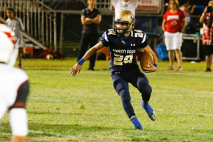 Dyllan Smiley led the Royals in rushing on Friday, but Bishop Diego was too much. By Owen Main