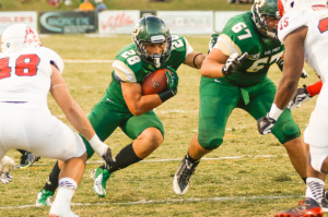 Joe Prothroe rushes up the middle for Cal Poly early in Saturday night's game. By Owen Main