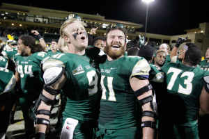 Brothers Colin and Nick Dzubnar celebrate Cal Poly's homecoming win over Montana State. By Owen Main