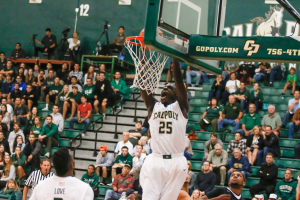 Joel Awich throws down a dunk in the second half. By Owen Main