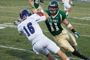 Johnny Millard makes a tackle in a 2013 game against Weber State. By Owen Main