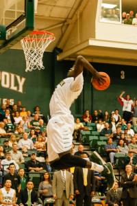 Joel Awich rears back to throw down a big dunk on Saturday night in Mott Athletics Center. By Owen Main