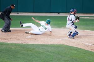 Ryan Drobny slides home safely on a Peter Van Gansen sacrifice fly on Tuesday night. By Owen Main