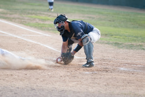 Ryan Sluder is thrown out at home plate in the first inning of Saturday's game. By Owen Main
