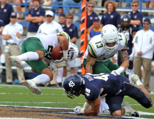 Opposing teams are finding places to get into the Cal Poly backfield and keep the Mustangs from getting the corner. Photo by Brooks Nuanez - SkylineSportsMt.com