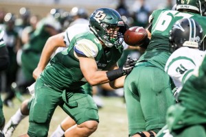 Joe Protheroe fumbles Cal Poly's first play from scrimmage Saturday night. By Owen Main